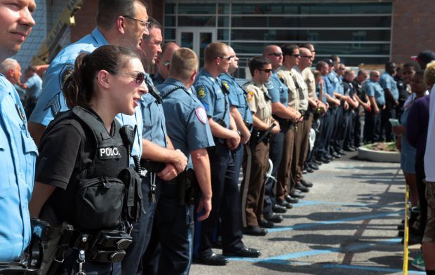 Protesters rally in front of Ferguson police station